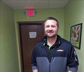 SERVPRO employee standing in the hallway