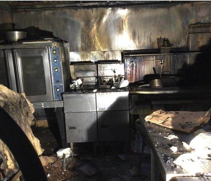 A kitchen with fire damage
