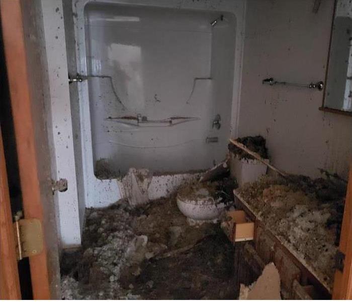 water damage in a commercial bathroom